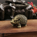 Brass hedgehog tea pet ornament